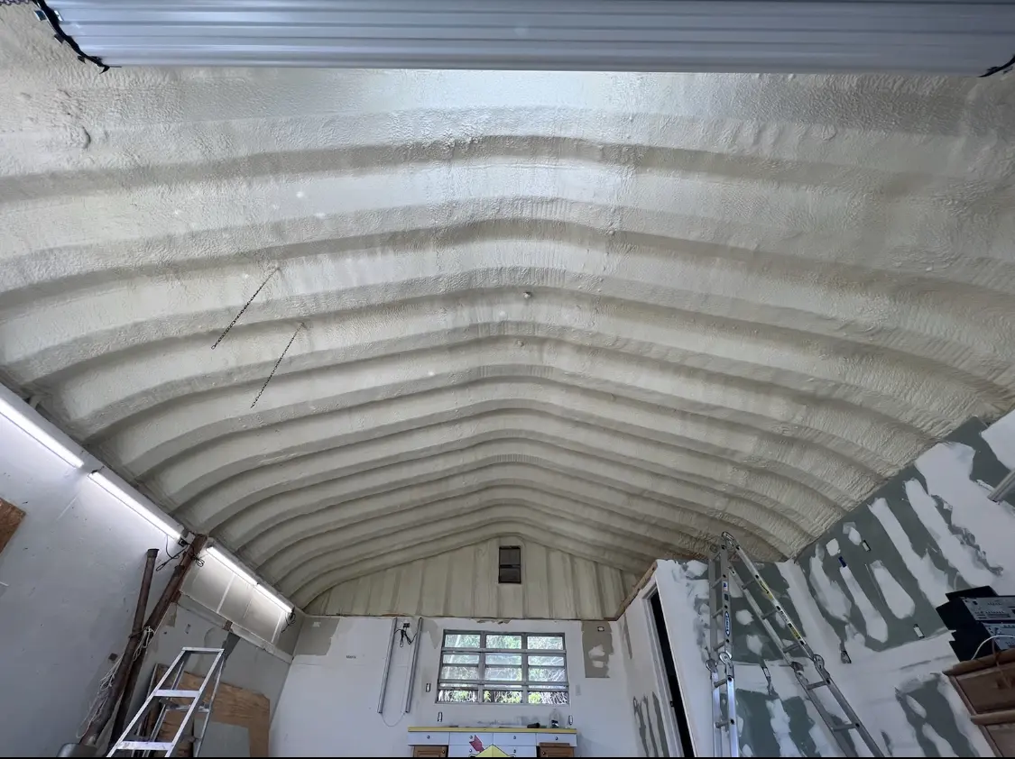 Spray polyurethane foam applied to the underside of a metal roof deck in York